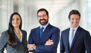 A group shot of three lawyers from Podhurst Orseck