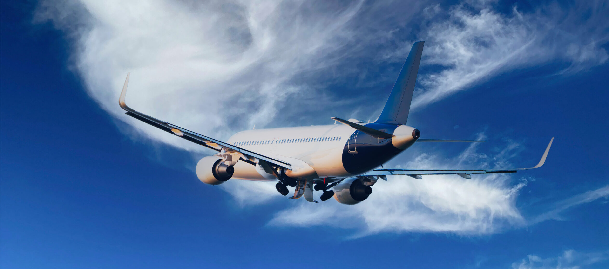 International flight in blue sky