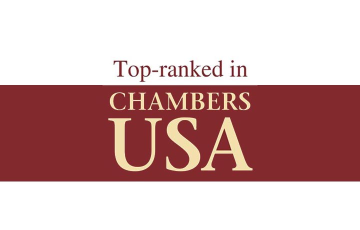 Text graphic with the words Top-ranked in CHAMBERS USA in large, bold letters on a maroon and white background.